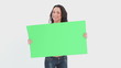 Woman shaking green card 