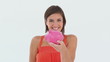 Girl makes a deposit in her piggy bank