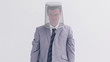 Angry man placing a bin on his head