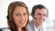 Call centre agents wearing headsets