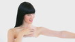 Smiling woman massaging her arm