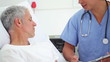 Serious patient talking with his doctor