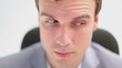 Serious executive sitting on a swivel chair