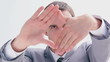 Serious brunette man making a hand gesture