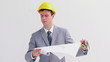 Serious architect reading blueprints