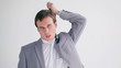 Frustrated businessman making a hanging gesture