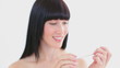 Smiling woman filing her nails