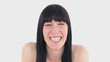 Happy brunette sending an air kiss