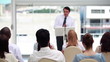 Man in suit speaking in a meeting