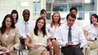 People in suits nodding
