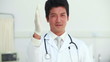 Doctor wearing a latex glove