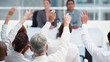 Business people raising their hands to ask questions