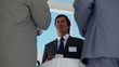 Low angle view of a businessman holding coffee cup
