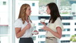 Video: Businesswomen drinking coffee together Businesswomen drinking coffee together