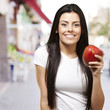 woman holding a mango woman holding a mango