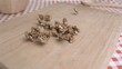 Walnut kernels falling in super slow motion on a wood board