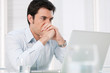 Pensive man at laptop