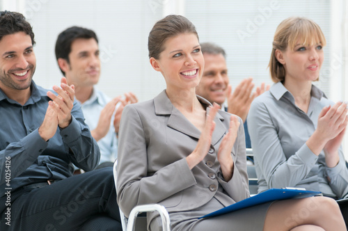 Photo: Business team clapping hands Business team clapping hands