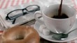 Coffee filling in super slow motion a cup