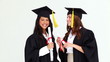 Happy graduated classmates talking to each other