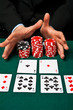 Gambler with cards and chips.