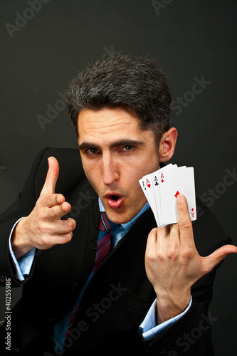 Photo: Young lucky gambler with cards Young lucky gambler with cards