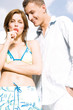 Young couple smiling, close-up, portrait