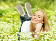 Foto: Beautiful female enjoying flower filed Beautiful female enjoying flower filed