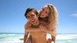 Blonde jumping on her boyfriend's back