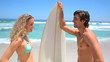 Blonde flirting with a surfer