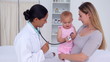 Baby playing with the doctor's stethoscope