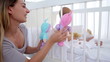 Woman playing dolls with her baby