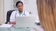 Doctor talking to a patient and taking notes