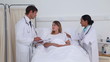 Doctors talking to a female patient