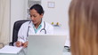 General practitioner asking question to a patient