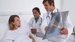 Doctor showing chest x-ray to a patient