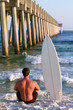 Surfboarder By Pier