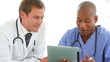 Two medical professionals using a tablet pc 