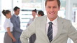 Video: Business man with hands on his sides Business man with hands on his sides