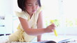 Girl colouring in a book on the floor