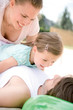 Girl with parents, smiling