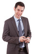 Portrait of a young caucasian business man using a mobile phone
