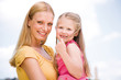 Mother with daughter, smiling