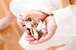 Girl holding shells, close-up