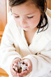 Girl holding shells, close-up