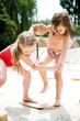 Girls playing on sand
