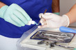 Photo: Female doctor taking fluid for dental plaque examine Female doctor taking fluid for dental plaque examine