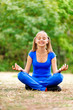 Teenage girl sitting in lotus position