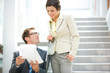 Business people holding document, smiling