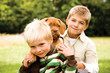 Boys playing with bulldog, portrait